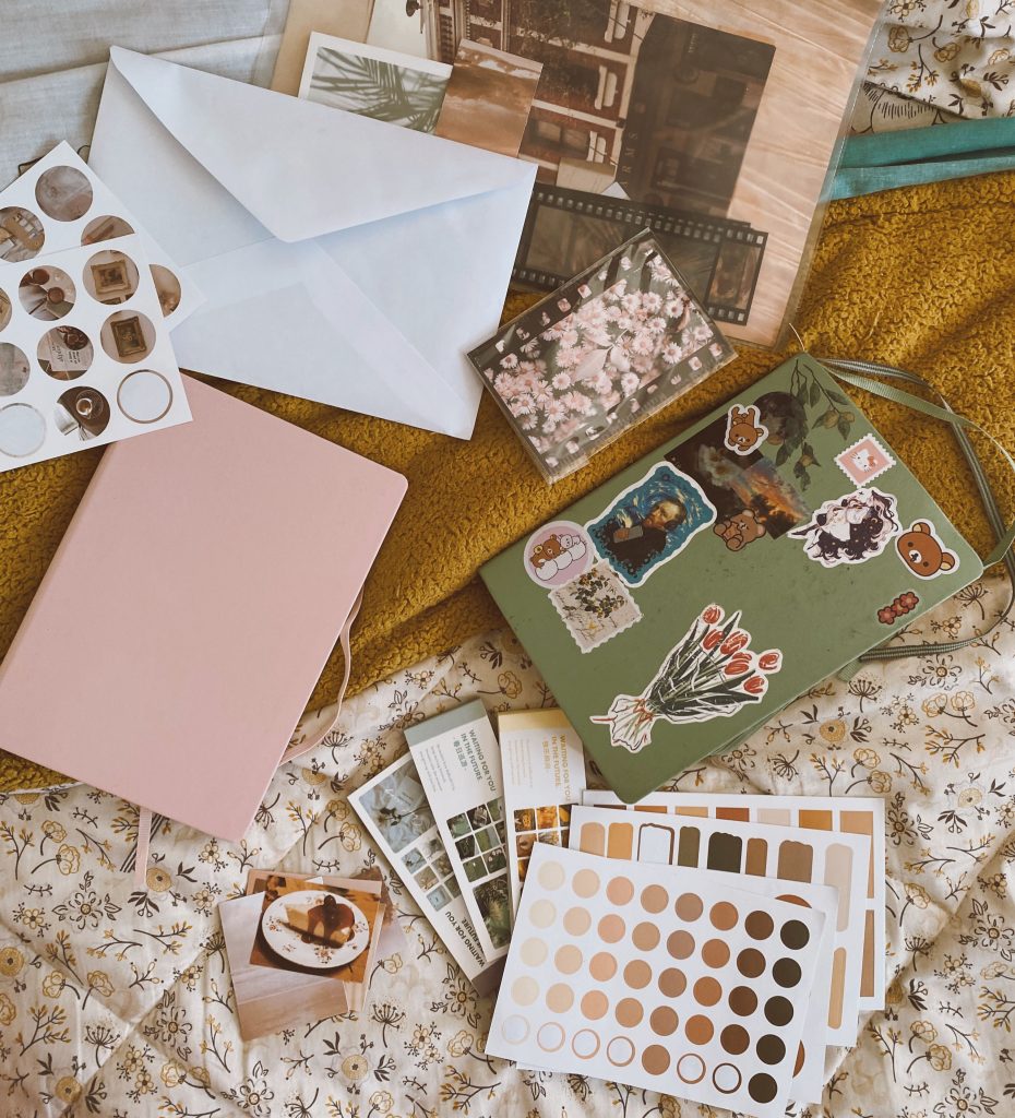 Person scrapbooking as a creative hobby during a digital detox to reduce screen time.