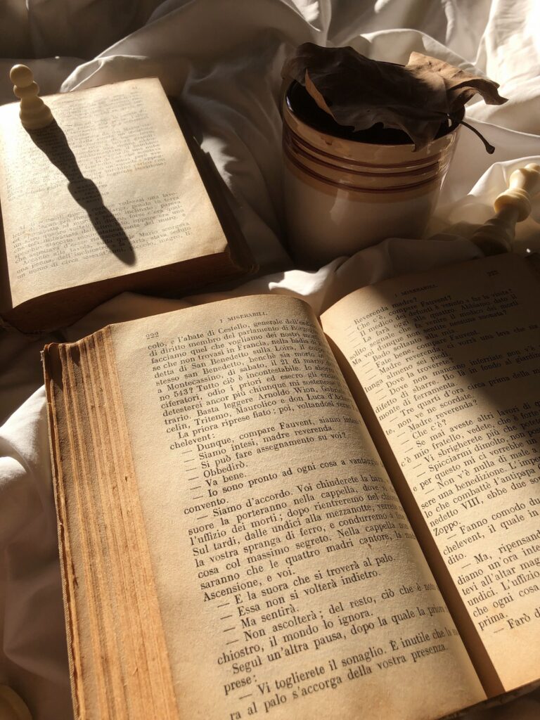 Book in natural sunlight representing mindful moments and romanticizing daily life.