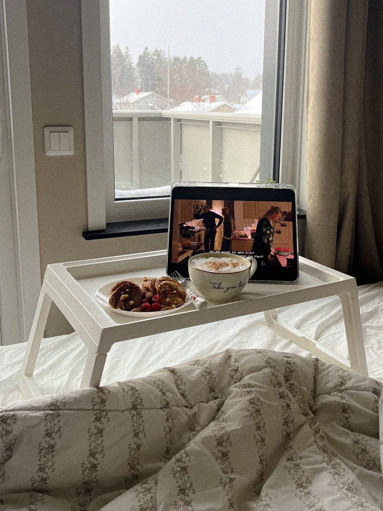Cozy morning workspace with laptop and breakfast for balancing rest and productivity